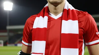 Woking FC welcomes left-back Anthony Georgiou on a short-term deal, bringing experience to the Cards' defense